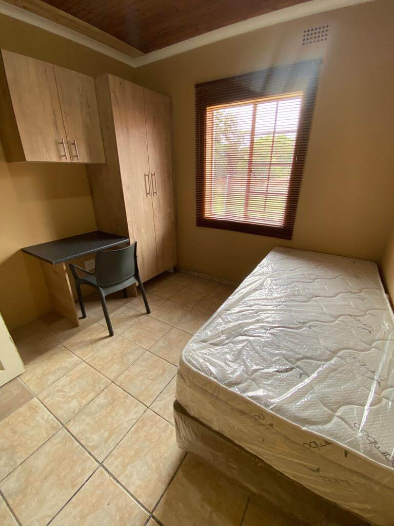 Furnished Bedrooom with a desk for students to use to study.